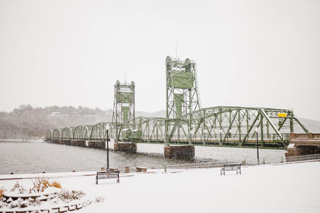 Things to do in Stillwater, shot of the historic lift bridge with snowfall and grey stormy clouds 